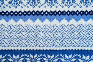 Pattern texture of blue and white winter sweater background
