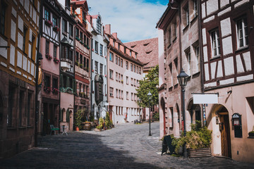 Fototapeta na wymiar Typical european styles alleyway in Nuremberg, Bavaria, Germany. The area has many restaurants and cafes