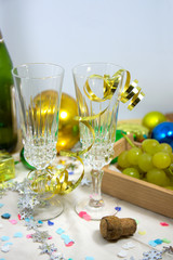 Table ready to celebrate Christmas with tall glasses of champagne