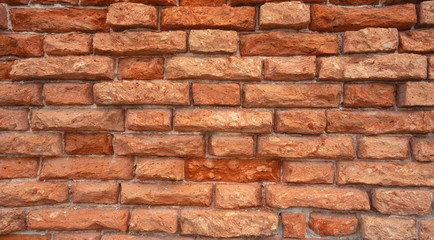 brick wall of red color, wide panorama of masonry