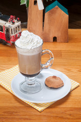 caffe mocha with whipped cream with cookie