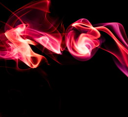 Red smoke on black background