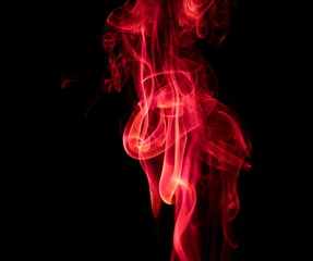 Red smoke on black background