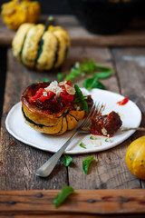 Meatball-stuffed squash with tomato sauce.selective focus