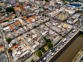 Large cities with river and great avenues. Aerial view of State Avenue next to the Tamanduatei River. Avenues close to the rivers. Big traffic. Sao Paulo city Brazil, South America.  
