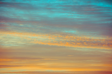 Naklejka na ściany i meble blue and orange sky clouds at sunset or sunrise.