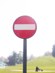 No entry for vehicles traffic sign against sky