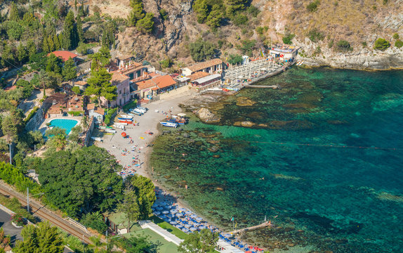 Cozy and relaxing bay with aquamarine water in Taormina. Province of Messina, Sicily, southern Italy.