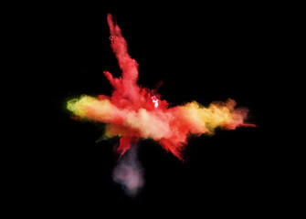 Fantastic forms of powder paint and flour combined  together explode in front of a black background to give off fantastic  explosions in bizarre multi colored cloud forms.