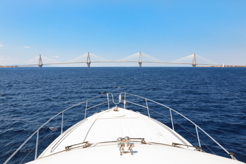 Fototapeta na wymiar The Rio Antirrio Bridge or Charilaos Trikoupis Bridge, photo taken from the boat during summer holidays 2018.