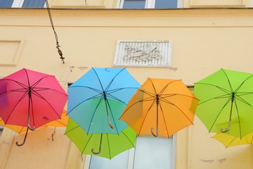 Colorful umbrellas on facade in Warsaw, Poland.