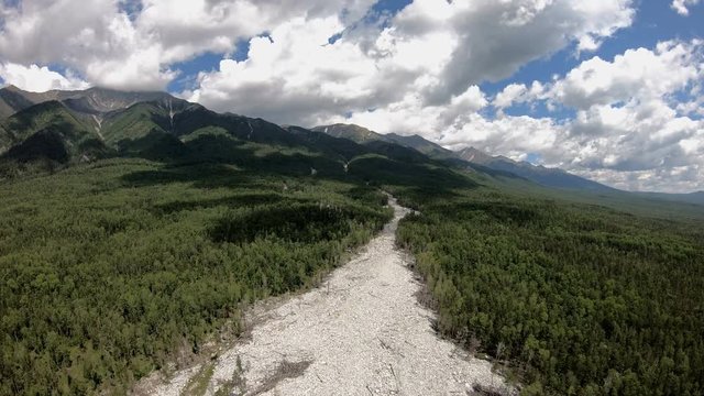 Drone rise up over the river of stones