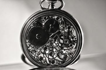 Skeleton of vintage handmade pocket watches, winter time and summer time concept, selective focus.