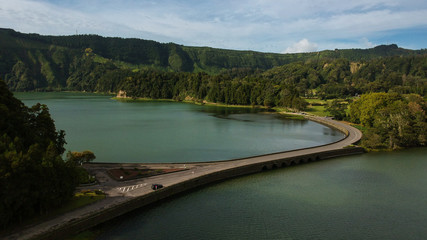 Aerial View from a beautiful lagoon surrounded by mountains. Ancient volcano crater. Seven Cities lagoon Azores Islands Portugal