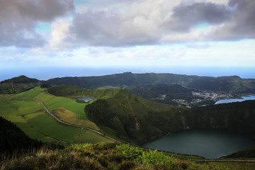 Aerial View from a beautiful lagoon surrounded by mountains. Ancient volcano crater. Seven Cities lagoon Azores Islands Portugal