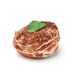 Glazed donut with cream and chocolate powder. View from a forty-five degree angle. Isolated image.