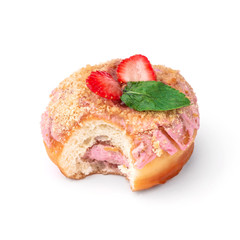 Donut with pink cream with nuts and strawberries. View from a forty-five degree angle. Isolated image. The side-bite donut.