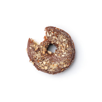 Glazed donut with milk chocolate and nutmeg. Top view. Isolated image. The side-bite donut.