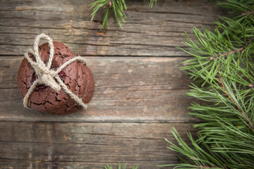 Christmas chocolate cookies with cranberry tied with twine