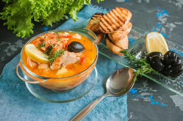 French fish soup Bouillabaisse with seafood, salmon fillet, shrimp, rich flavor, delicious dinner...
