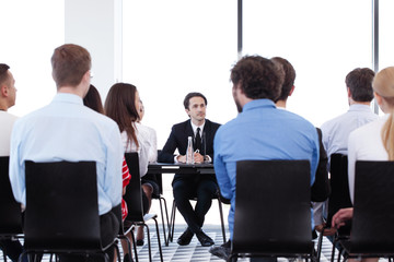 Speakers at business meeting