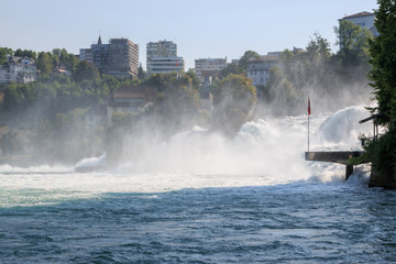 The Rhine Falls is the largest waterfall in Europe in Schaffhausen, Switzerland. Summer day with sun