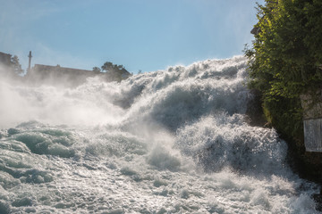 The Rhine Falls is the largest waterfall in Europe in Schaffhausen, Switzerland. Summer day with sun