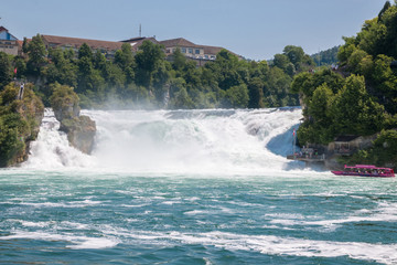 The Rhine Falls is the largest waterfall in Europe in Schaffhausen, Switzerland. Summer day with sun