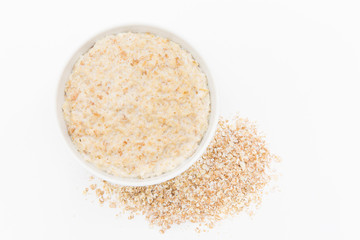 Oatmeal in white bowl on white background. Isolated on white. Healthy food