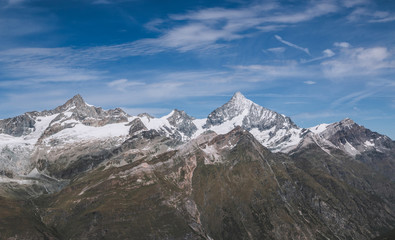 View closeup mountains scenes in national park Zermatt, Switzerland, Europe. Summer landscape, sunshine weather, dramatic blue sky and sunny day