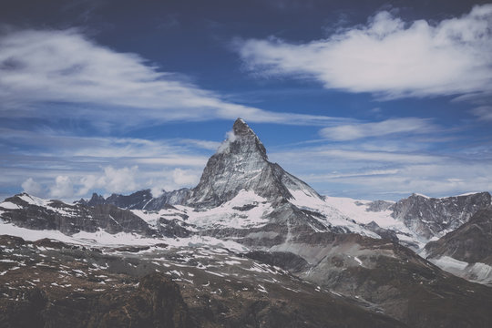View closeup Matterhorn mountain, scenes in national park Zermatt, Switzerland, Europe. Summer landscape, sunshine weather, dramatic blue sky and sunny day. Print poster, image, photo, picture