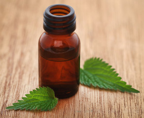 Nettle leaves with extract in a bottle