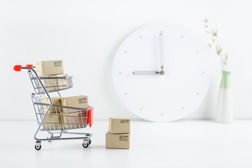 Shop online, ecommerce / retail commerce concept : Box or cartons in a trolley or shopping cart on...