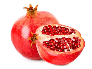 Ripe pomegranate and half close-up on a white. Isolated