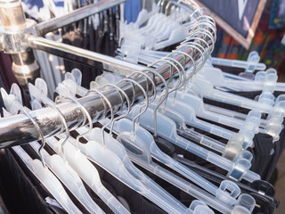 Rack with hangers in a clothe store.