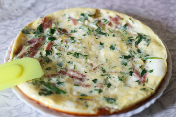 tasty magnificent omelet with greens and sausage