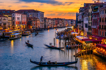 Fototapeta na wymiar Grand Canal with gondolas in Venice, Italy. Sunset view of Venice Grand Canal. Architecture and landmarks of Venice. Venice postcard