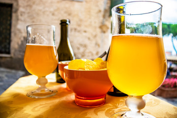 Aperitif with craft beer and chips, in a bar in the central square of Ravello. In the province of...