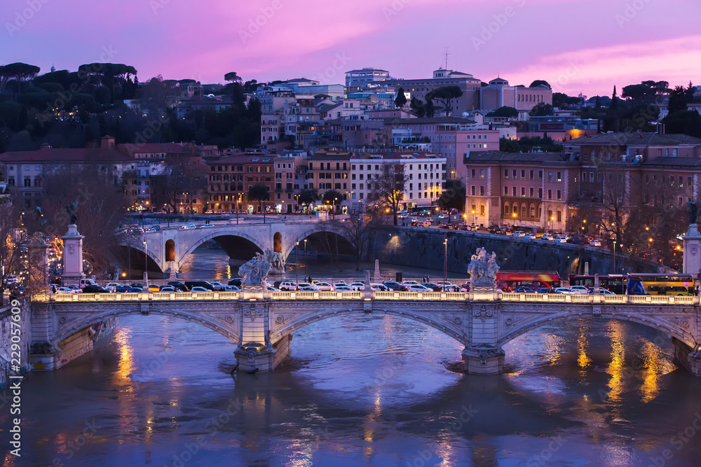 Wall mural view of the tiber river with a bridge at sunset, rome