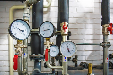 House heating system with many steel pipes, manometers and metal tubes