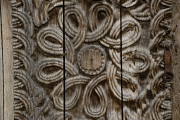 Еlement woodcarving. The pattern of flower carved on the wooden