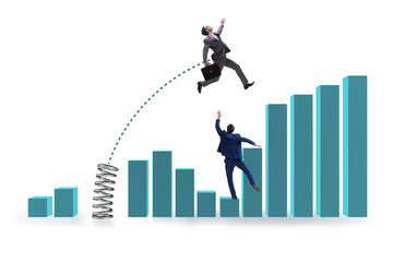 Businessman outperforming his competition jumping over