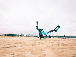 Preparing for kitesurfing at the beach.