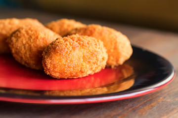 Freshly cooked breaded meat cutlets on plate