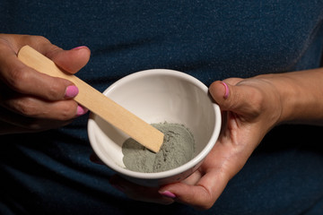 A woman makes a cosmetic mask