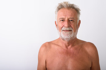 Obraz premium Close up of handsome senior bearded man shirtless against white 