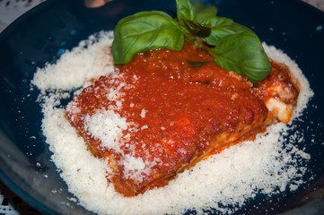 Lasagna with tomato sauce and cheese.