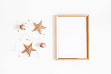 Christmas composition. Photo frame, golden decorations on white background. Christmas, winter, new...