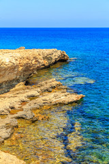 Fototapeta premium A view of a azzure water and Nissi beach in Aiya Napa, Cyprus