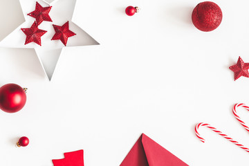 Christmas red decorations on white background. Christmas, new year, winter concept. Flat lay, top view, copy space